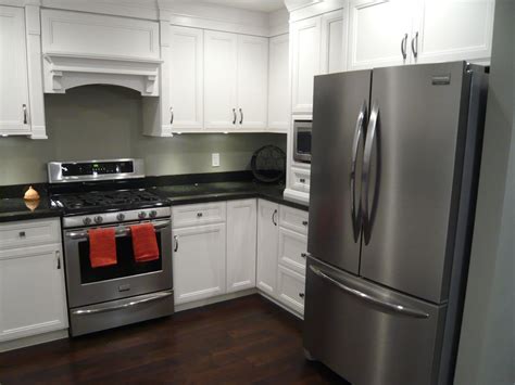 granite countertops white cabinets black stainless steel appliances|black and white countertops.